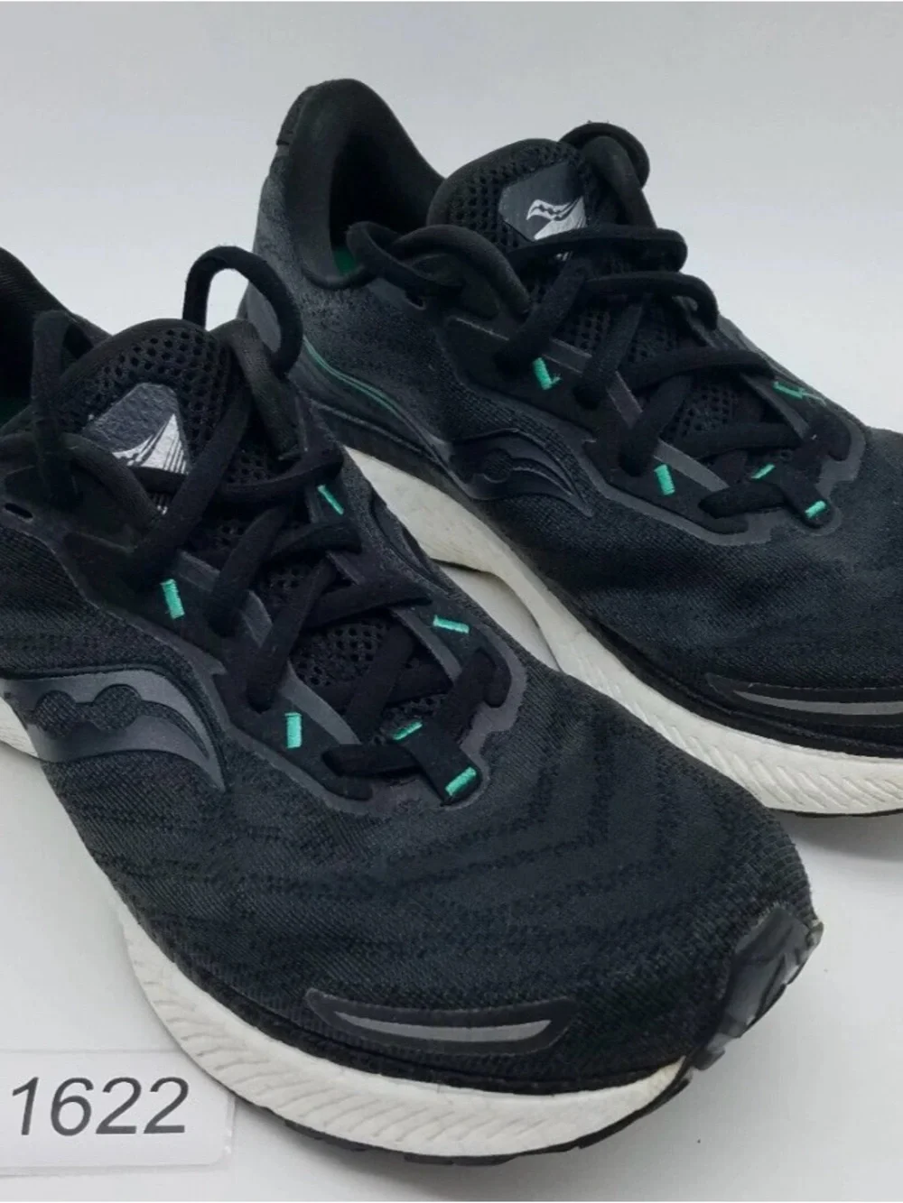 Saucony Black Running Shoes with Teal Accents